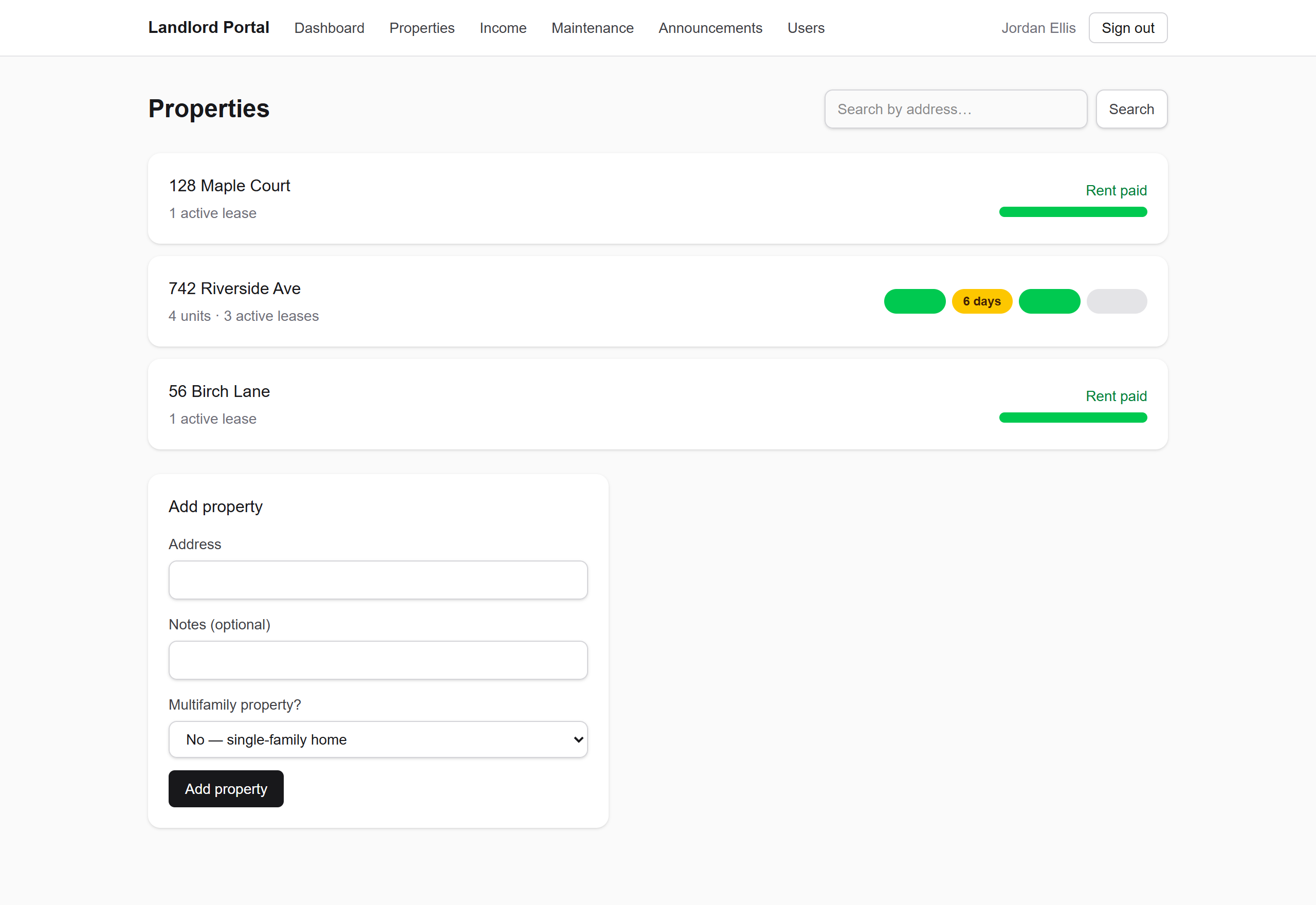 RoostKey properties list with green, amber, and grey rent-status indicators per unit